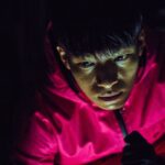 Wi Ha-joon (Hwang Jun-ho) In Squid Game Credits: Youngkyu Park / Netflix