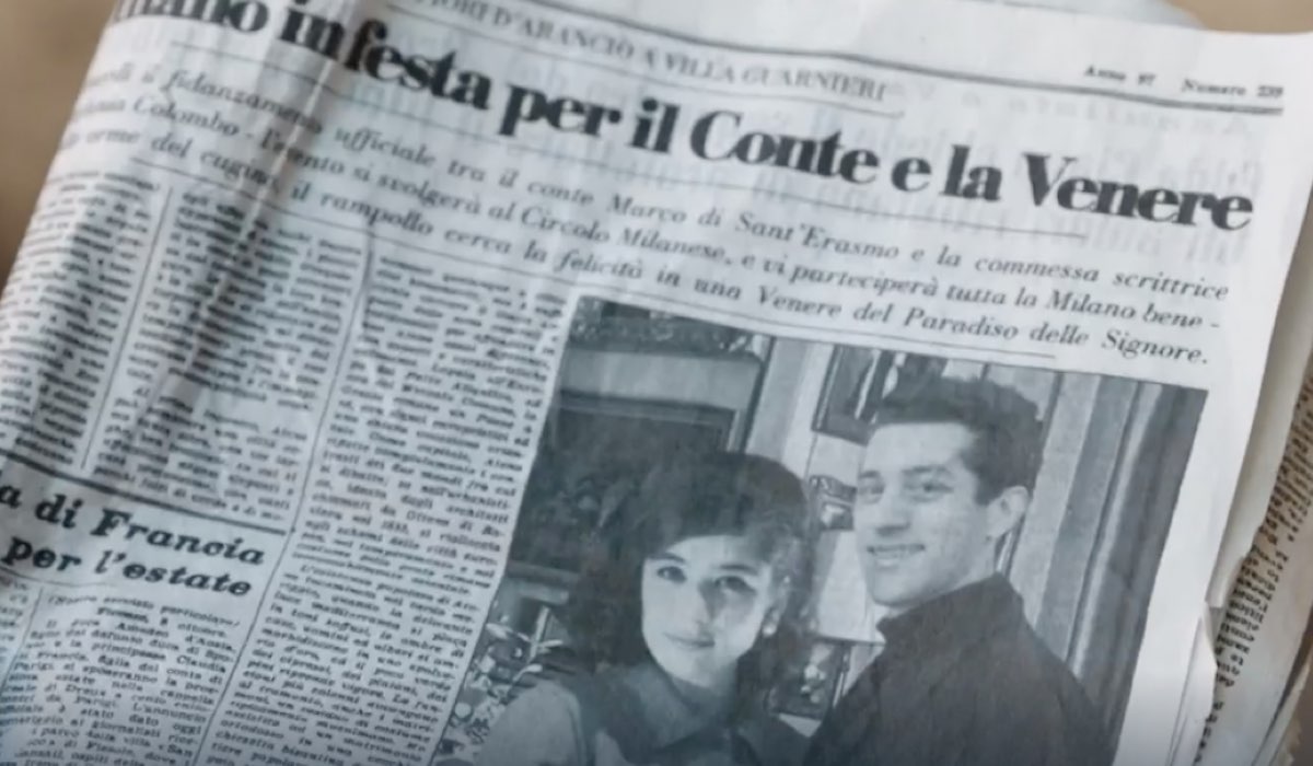 Da sinistra: Grace Ambrose (Stefania Colombo) e Moisé Curia (Marco di Sant’Erasmo) in una foto di giornale in una scena della puntata 3 de 