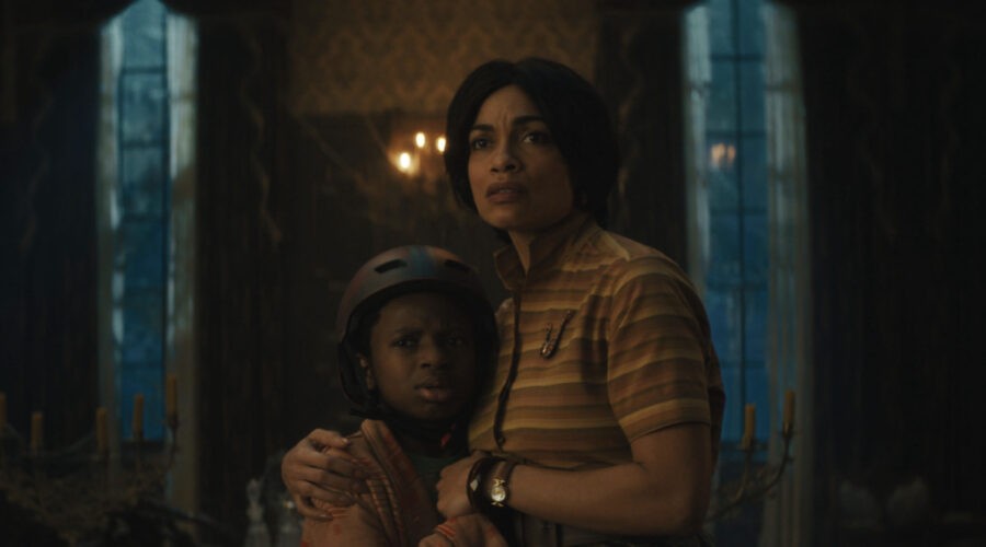 Chase Dillon As Travis And Rosario Dawson As Gabbie In Disney Live-action Haunted Mansion Photo Courtesy Of Disney